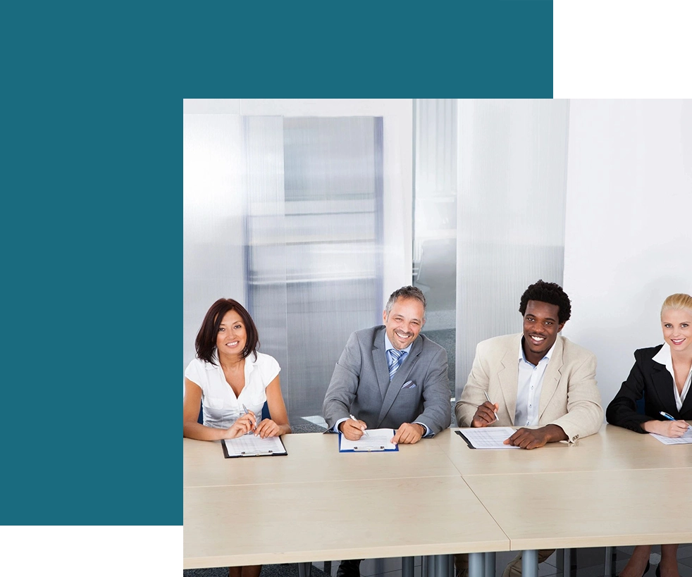 A group of people sitting at a table.